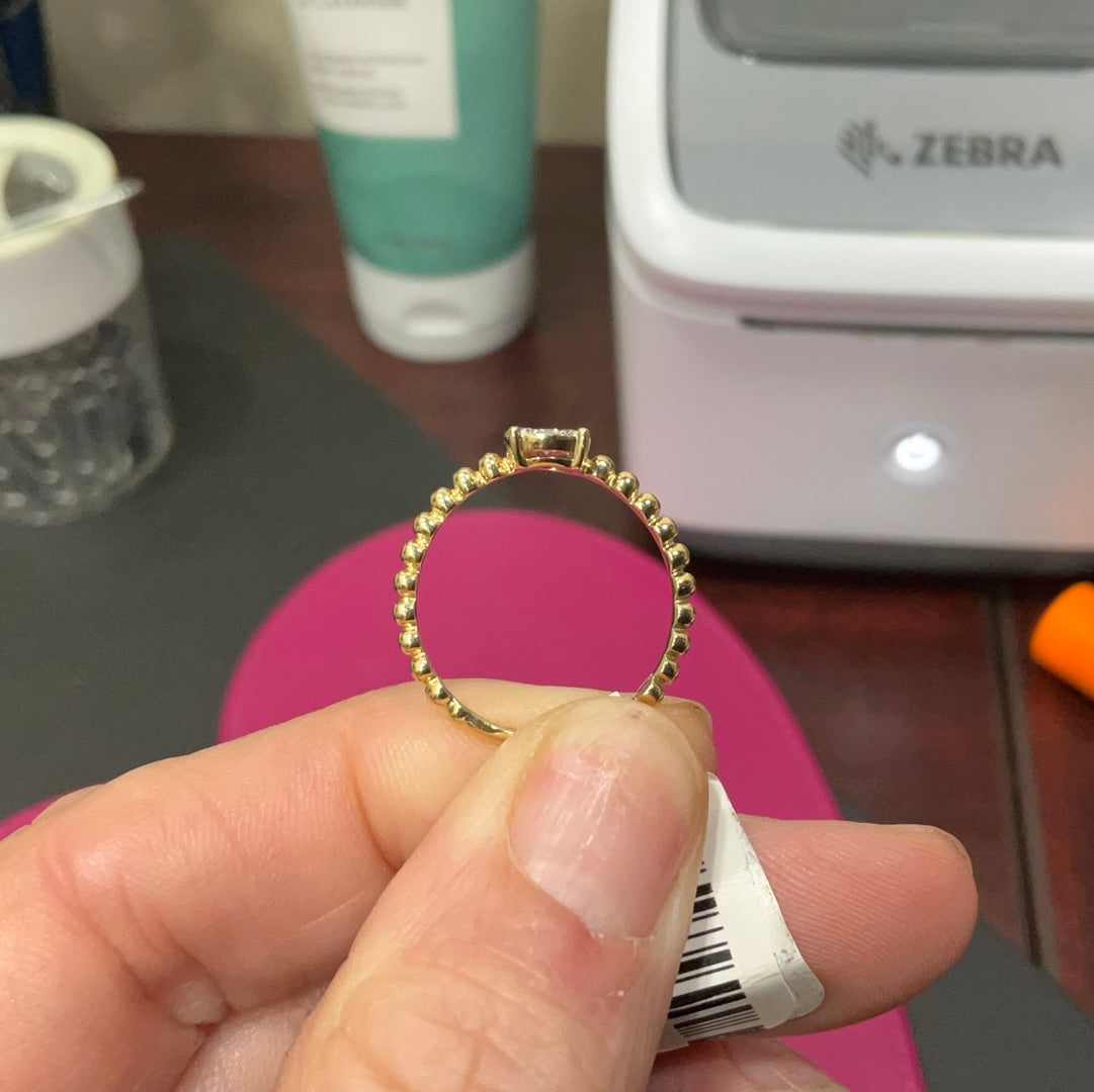 14ky headed ring .20 diamond